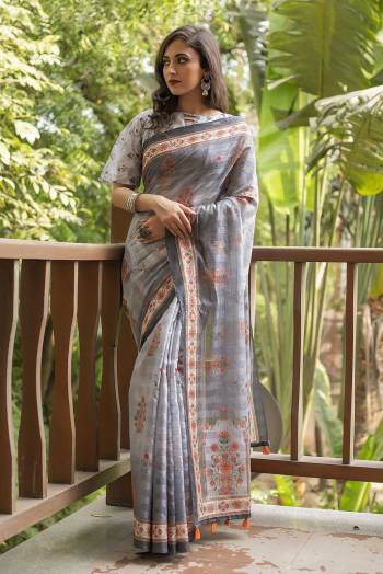 Garb This Partywear Saree Are Fine Saree Paired With Blouse.  This Designer Wevon Jari With Digital Printed Saree And Blouse Are Linen Cotton Fabric. Which Gives A Rich Look To Your Personality. Buy This Pretty Saree Now.