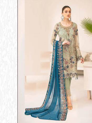 Garb This Designer Long Length Pakistani Suit In Lovely Light Color.?Its Pretty Heavy Designer Embroidred Work Top Is Faux Grorgette Based Paired With Santoon Bottom And Naznin Fabricated Dupatta Which Gives An Attractive To The Suit.