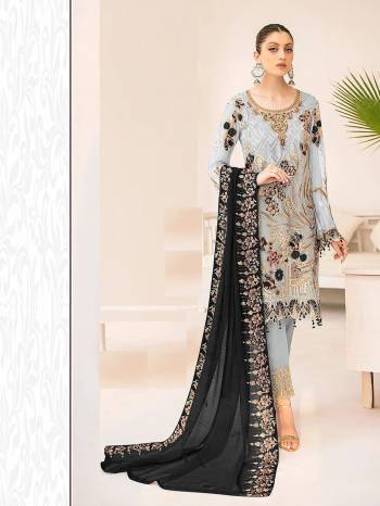 Garb This Designer Long Length Pakistani Suit In Lovely Light Color.?Its Pretty Heavy Designer Embroidred Work Top Is Faux Grorgette Based Paired With Santoon Bottom And Naznin Fabricated Dupatta Which Gives An Attractive To The Suit.