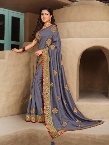 Look Attractive Wearing This Fine Colored Saree Paired With Blouse.  This Heavy Designer Saree Is Vichitra Silk Based Which Gives A Rich Look To Your Personality. Buy This Pretty Saree Now.