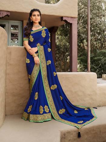 Look Attractive Wearing This Fine Colored Saree Paired With Blouse.  This Heavy Designer Saree Is Vichitra Silk Based Which Gives A Rich Look To Your Personality. Buy This Pretty Saree Now.