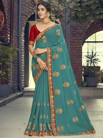 Look Attractive Wearing This Fine Colored Saree Paired With Contrasted Blouse.  This Heavy Designer Saree Is Georgette Based Which Gives A Rich Look To Your Personality. Buy This Pretty Saree Now.