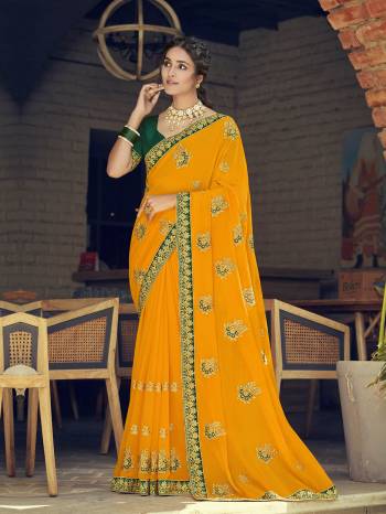 Look Attractive Wearing This Fine Colored Saree Paired With Contrasted Blouse.  This Heavy Designer Saree Is Georgette Based Which Gives A Rich Look To Your Personality. Buy This Pretty Saree Now.