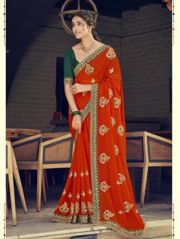 Look Attractive Wearing This Fine Colored Saree Paired With Contrasted Blouse.  This Heavy Designer Saree Is Georgette Based Which Gives A Rich Look To Your Personality. Buy This Pretty Saree Now.