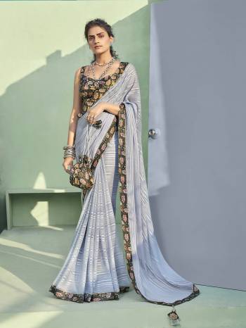 Grab This Pretty Elegant Looking Designer Saree In Fine Light Color Paired With Multy Color Blouse. This Saree Are Chiffon And Blouse Are Art Silk Based Beautified With Printed Blouse And Borer And Parsh. Buy Now.