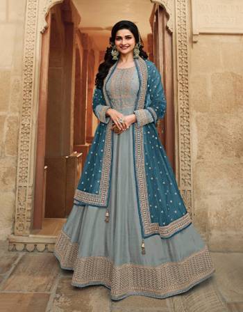 Look Pretty This Designer Anarkali Suit In Lovely Fine Light Color.?Its Pretty Heavy Designer Embroidred Work Top Is Doll Silk Based Paired With Santoon Bottom And Soft Net Fabricated Work Dupatta Which Gives An Attractive To The Suit.