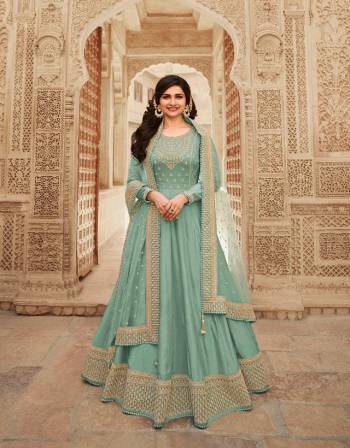 Look Pretty This Designer Anarkali Suit In Lovely Fine Light Color.?Its Pretty Heavy Designer Embroidred Work Top Is Doll Silk Based Paired With Santoon Bottom And Soft Net Fabricated Work Dupatta Which Gives An Attractive To The Suit.