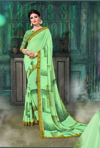 Garb This Designer Saree Are Fine Saree Paired With Blouse.  This Designer Printed Saree Is Georgette Based And Blouse Are Georgette Fabric. Which Gives A Rich Look To Your Personality. Buy This Pretty Saree Now.