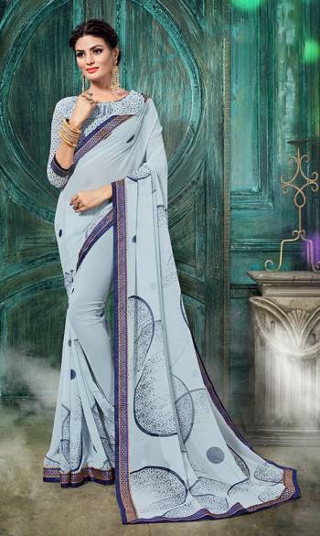 Garb This Designer Saree Are Fine Saree Paired With Blouse.  This Designer Printed Saree Is Georgette Based And Blouse Are Georgette Fabric. Which Gives A Rich Look To Your Personality. Buy This Pretty Saree Now.