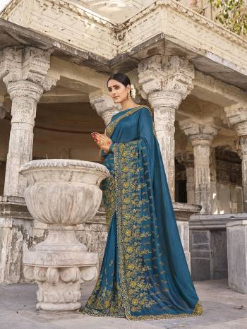 Look Attractive Wearing This Fine Colored Saree Paired With Blouse.  This Heavy Designer Saree Is Vichitra Silk Based Which Gives A Rich Look To Your Personality. Buy This Pretty Saree Now.