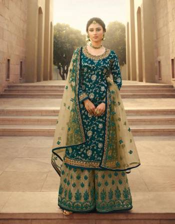 Garb This Designer Long Length Designer Plazzo Suit In Lovely Fine Color.?Its Pretty Heavy Designer Wevon Jacquard And Embroidred Work Top Is Dola Silk Based Paired With Soft Net Bottom And Soft Net Fabricated Dupatta Which Gives An Attractive To The Suit.