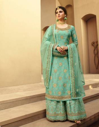 Garb This Designer Long Length Designer Plazzo Suit In Lovely Fine Color.?Its Pretty Heavy Designer Wevon Jacquard And Embroidred Work Top Is Dola Silk Based Paired With Soft Net Bottom And Soft Net Fabricated Dupatta Which Gives An Attractive To The Suit.