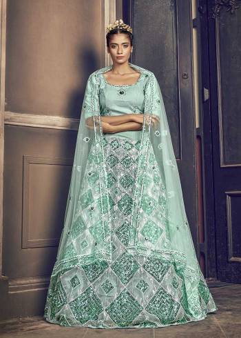 Attrective Bridal Partywear Heavy Designer Lehenga Choli And Dupatta In Blue Color Fabricated On Net Beautified With Heavy Attractive Seaqoance Embroidery Work. 