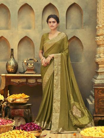 Grab This Pretty Elegant Looking Designer Saree In Fine Color Paired With Blouse. This Saree Are Chiffon And Blouse Are Art Silk Based Beautified With Pallu Embroidery,Diamond Work. Buy Now.