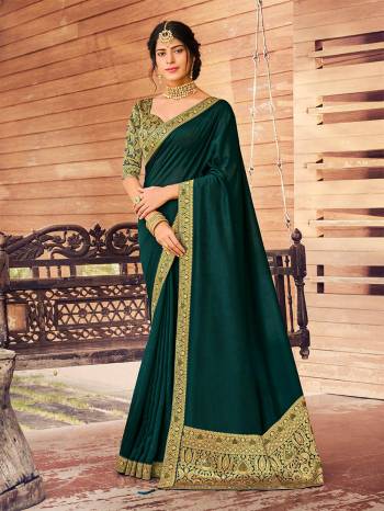 Grab This Pretty Elegant Looking Designer Saree In Fine Color Paired With Blouse. This Saree Are Vichitra Silk And Blouse Are Art Silk Based Beautified With Jacquard Pallu Border And Blouse. Buy Now.