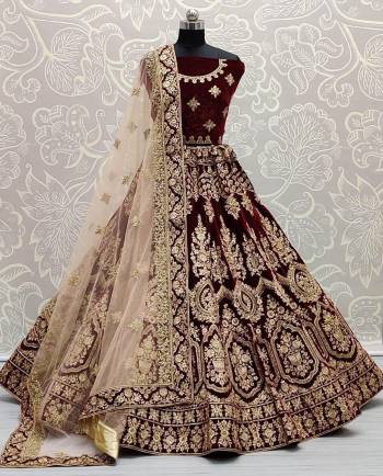 Garb This Bridal Partywear Heavy Designer Lehenga Choli And Dupatta In Fine Color Fabricated On Velvet Beautified With Heavy Attractive Dori Jari Embroidery And Diamond Work. 