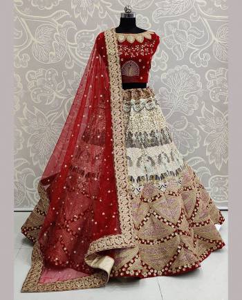 Garb This Bridal Partywear Heavy Designer Lehenga Choli And Dupatta In Fine Color Fabricated On Velvet Beautified With Heavy Attractive Dori Jari Embroidery And Diamond Work. 