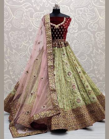 Looking Attrective Bridal Partywear Heavy Designer Lehenga Choli And Dupatta In Fine Color Fabricated On Velvet Beautified With Heavy Attractive Embroidery Work And Diamond Work. 