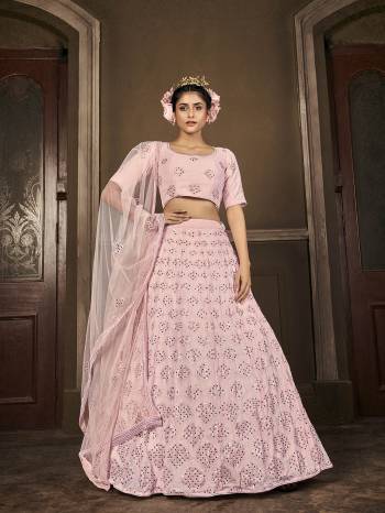 Attrective Bridal Partywear Heavy Designer Lehenga Choli In Light Color Fabricated On Georgette Beautified And Dupatta Are Net With Heavy Attractive Seaqoance Embroidery Work. 