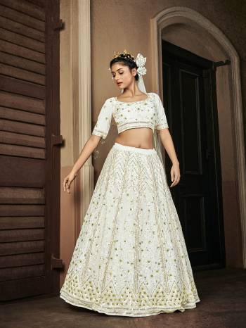 Attrective Bridal Partywear Heavy Designer Lehenga Choli In Light Color Fabricated On Georgette Beautified And Dupatta Are Net With Heavy Attractive Seaqoance Embroidery Work. 