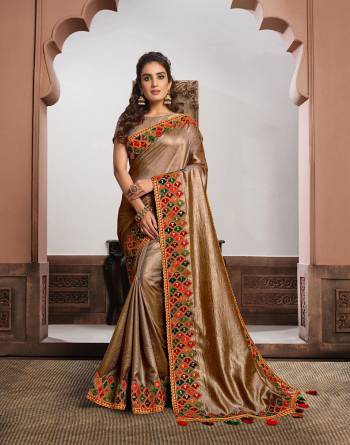 Look Attractive Wearing This Fine Colored Saree Paired With Blouse.  This Heavy Designer Saree Is Satin Silk Based Which Gives A Rich Look To Your Personality. Buy This Pretty Saree Now.