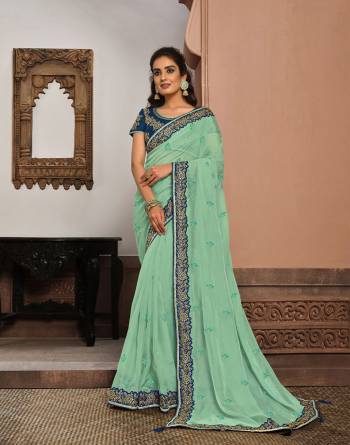 Look Attractive Wearing This Fine Colored Saree Paired With Blouse.  This Heavy Designer Saree Is Tissue Based Which Gives A Rich Look To Your Personality. Buy This Pretty Saree Now.