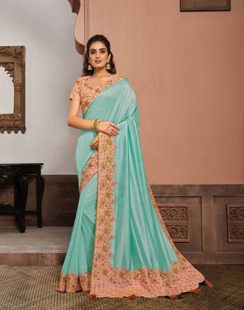 Look Attractive Wearing This Fine Colored Saree Paired With Blouse.  This Heavy Designer Saree Is Silk Based Which Gives A Rich Look To Your Personality. Buy This Pretty Saree Now.