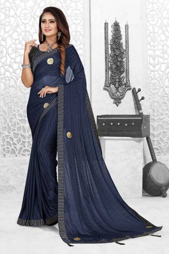 Grab This Pretty Elegant Looking Designer Saree In Fine Color Paired With Blouse. This Saree And Blouse Are Spandex Poly Blend Based Beautified With Wevon Designer. Buy Now.