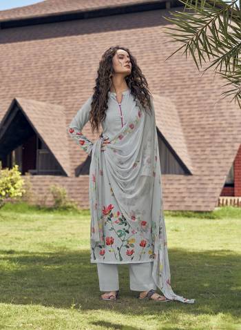 Attrective This Designer Long Length Suit In Lovely Light Color.?Its Pretty Heavy Designer Digital Printed With Hand Work Top Is Cambric Cotton Based Paired With Cotton Bottom And Bemberg Chiffon Fabricated Dupatta Which Gives An Attractive To The Suit.