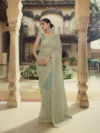 Garb This Wedding Partywear Saree Are Fine Saree Paired With Blouse.  This Heavy Designer Embroidery Work Saree And Blouse Are Soft Net Based Fabric. Which Gives A Rich Look To Your Personality. Buy This Pretty Saree Now.