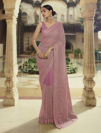 Garb This Wedding Partywear Saree Are Fine Saree Paired With Blouse.  This Heavy Designer Embroidery Work Saree And Blouse Are Soft Net Based Fabric. Which Gives A Rich Look To Your Personality. Buy This Pretty Saree Now.