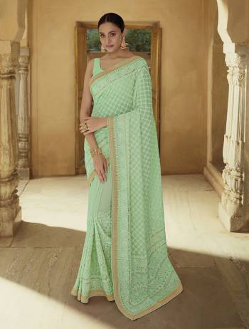 Garb This Wedding Partywear Saree Are Fine Saree Paired With Blouse.  This Heavy Designer Embroidery Work Saree And Blouse Are Georgette Based Fabric. Which Gives A Rich Look To Your Personality. Buy This Pretty Saree Now.