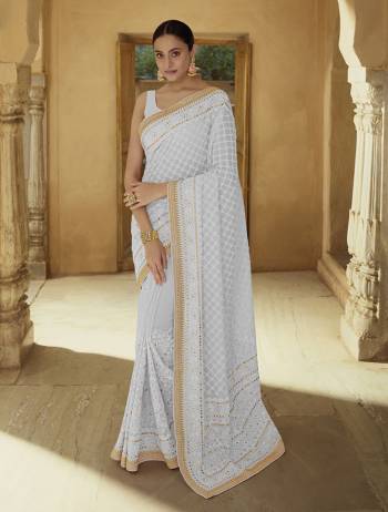 Garb This Wedding Partywear Saree Are Fine Saree Paired With Blouse.  This Heavy Designer Embroidery Work Saree And Blouse Are Georgette Based Fabric. Which Gives A Rich Look To Your Personality. Buy This Pretty Saree Now.