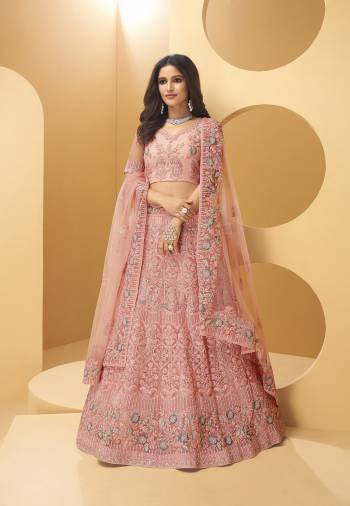 Attrective Bridal Partywear Heavy Designer Lehenga Choli And Dupatta In Lignt Color Fabricated On Net Beautified With Heavy Attractive Cording,Thread,Seaquance Embroidery With Hand Zarkan Work. 