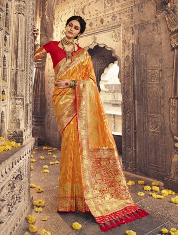 Garb This Partywear Saree Are Fine Saree Paired With Blouse.This Heavy Designer Wevon Work Saree And Blouse Are Banarasi Silk Based Fabric. Buy This Pretty Saree Now.