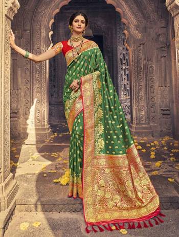 Garb This Partywear Saree Are Fine Saree Paired With Blouse.This Heavy Designer Wevon Work Saree And Blouse Are Banarasi Silk Based Fabric. Buy This Pretty Saree Now.