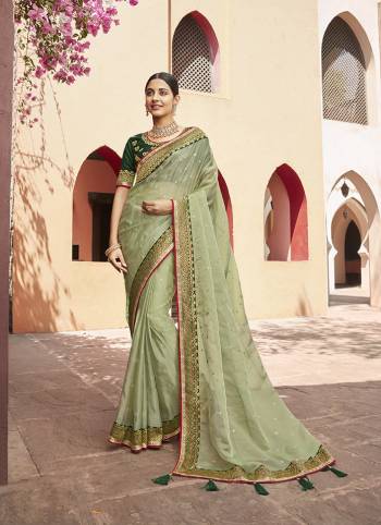Attrective This Partywear Saree Are Fine Saree Paired With Blouse.This Butti Embroidery Work Saree Are Soft Organza And Blouse Are Art Silk Wevon Design Based Fabric. Buy This Pretty Saree Now.