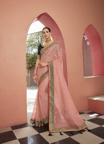 Attrective This Partywear Saree Are Fine Saree Paired With Blouse.This Butti Embroidery Work Saree Are Soft Organza And Blouse Are Art Silk Wevon Design Based Fabric. Buy This Pretty Saree Now.