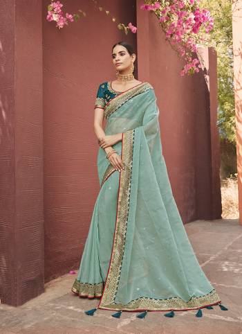 Attrective This Partywear Saree Are Fine Saree Paired With Blouse.This Butti Embroidery Work Saree Are Soft Organza And Blouse Are Art Silk Wevon Design Based Fabric. Buy This Pretty Saree Now.