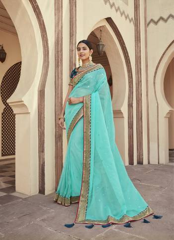 Attrective This Partywear Saree Are Fine Saree Paired With Blouse.This Butti Embroidery Work Saree Are Soft Organza And Blouse Are Art Silk Wevon Design Based Fabric. Buy This Pretty Saree Now.
