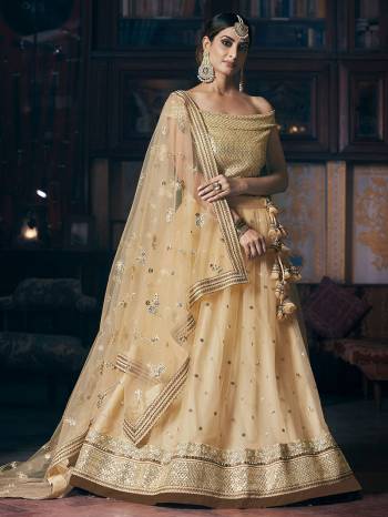 Look Attrective Bridal Partywear Heavy Designer Lehenga Choli And Dupatta In Lignt Color Fabricated On Net Beautified With Heavy Attractive Jari,Thread,Seaquance Embroidery. 