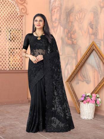 Garb This Partywear Saree Are Fine Saree Paired With Blouse.This Heavy Designer Thread Embroidery,Moti & Stone Work Saree And Blouse Are Net Based Fabric With Inner Satin. Buy This Pretty Saree Now.