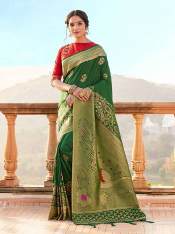 Garb This Fine Colored Saree Paired With Contreased Blouse.This Heavy Designer Wevon Saree Is Banarasi Silk Based Which Gives A Rich Look To Your Personality. Buy This Pretty Saree Now.