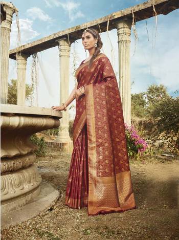 Garb This Partywear Saree Are Fine Saree Paired With Blouse.This Saree And Blouse Are Banarasi Silk With Heavy Wevon Designer Work Based Fabric. Buy This Pretty Saree Now.