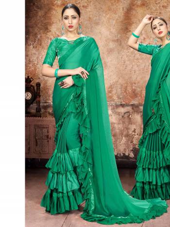 Attrective Partywear This Fine Colored Saree Paired With Contreased Blouse.This Heavy Ruffle Frill Hand Work Designer  Saree Is Georgette Based Which Gives A Rich Look To Your Personality. Buy This Pretty Saree Now.