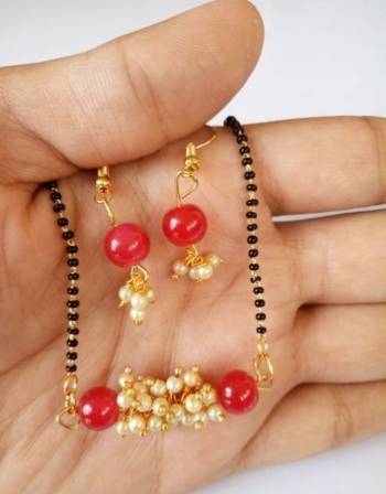 An Enhanced Look To Your Personality By Pairing Up This Beautiful Mangalsutra Set With Your Ethnic Attire. This Pretty Set Is In Golden Color Beautified With Beads Work. Buy Now.