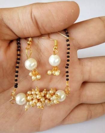 An Enhanced Look To Your Personality By Pairing Up This Beautiful Mangalsutra Set With Your Ethnic Attire. This Pretty Set Is In Golden Color Beautified With Beads Work. Buy Now.