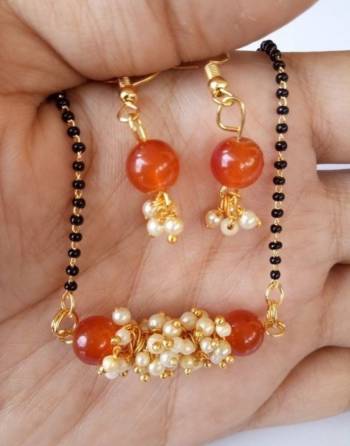 An Enhanced Look To Your Personality By Pairing Up This Beautiful Mangalsutra Set With Your Ethnic Attire. This Pretty Set Is In Golden Color Beautified With Beads Work. Buy Now.