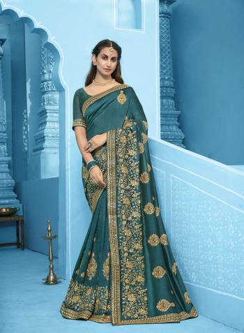 Attrective This Partywear Saree Are Fine Saree Paired With Blouse.This Saree And Blouse Are Vichitra Silk Fabric With Heavy Designer Embroidery With Diamond Work. Buy This Pretty Saree Now.