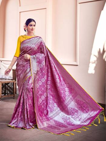 Garb This Fine Colored Saree Paired With Contreased Blouse.This Heavy Designer Wevon Saree Is Banarasi Silk Based Which Gives A Rich Look To Your Personality. Buy This Pretty Saree Now.